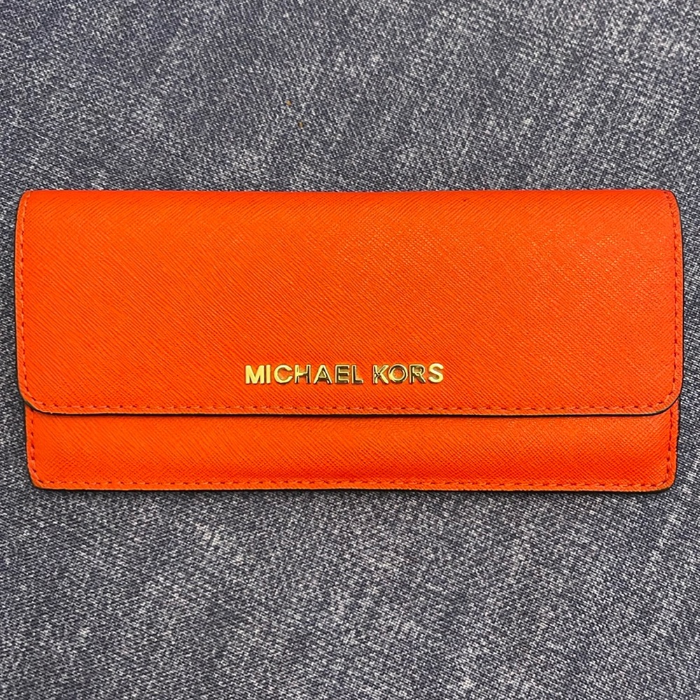 Michael Kors red slim wallet hold 8 credit cards with coin zipper.